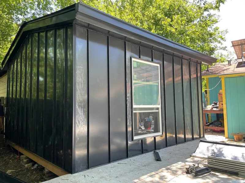 Black standing seam metal wall panels for Roof Inspection in Nelson