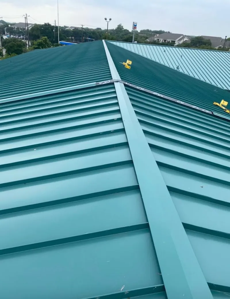 Green commercial metal roof ridge and valley for Metal Roof Repair in Nelson